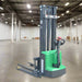 Green and gray forklift on a white background