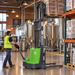 EKKO EB13C-118Li walkie stacker lifting a pallet of beer cases onto an upper rack in a craft brewery
