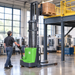 EKKO EB13C-118Li walkie stacker lifting a pallet of boxes up to a mezzanine in a manufacturing shop